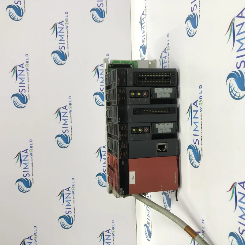 Mitsubishi PLC rack with modules, likely Mitsubishi MELSEC system